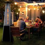 a family having dinner outside and warming up