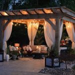 outdoor space at night with cozy furniture and lights